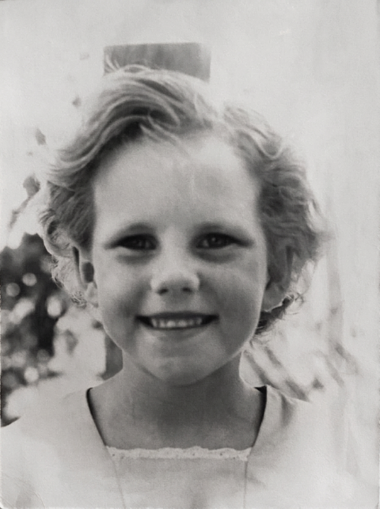 A black and white photo of Sandra when she was a child.