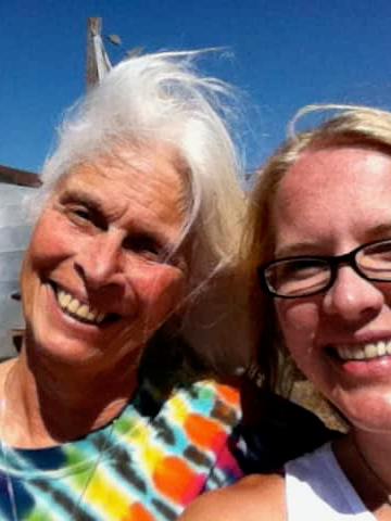 Sue and her friend in a tie-dye shirt, the Santa Cruz Coast, and a farmer's produce stand—photo taken and copyrighted by Sue Evergreen.