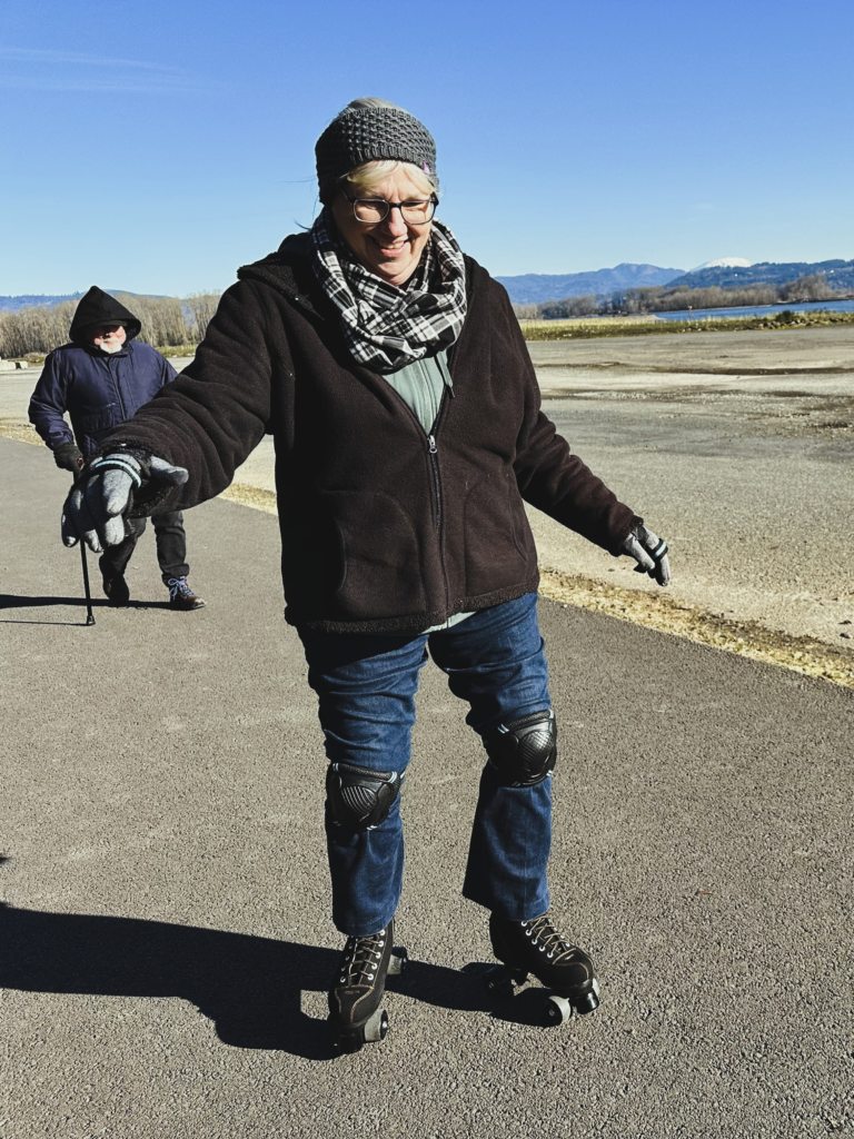 A photo of Sandra trying her new roller skates at age 70. Image taken and copyrighted by Sue Evergreen.
