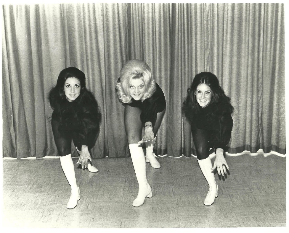 Suzanne, with her dance team, wearing go-go boots for USO tours in the 1970s. Suzanne Wright gave permission for Onward Sister to use her image.
