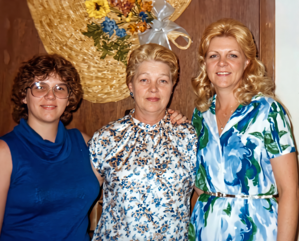 A restored photo of Suzanne's sister, mother, and her. Image permission was given by Suzanne Wright to Onward Sister.